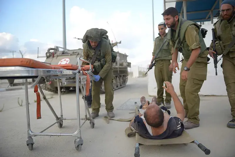 Israeli soldiers helping a wounded person.