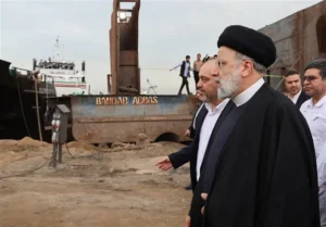 Officials of Iran supervising the start of the construction of a new nuclear plant.