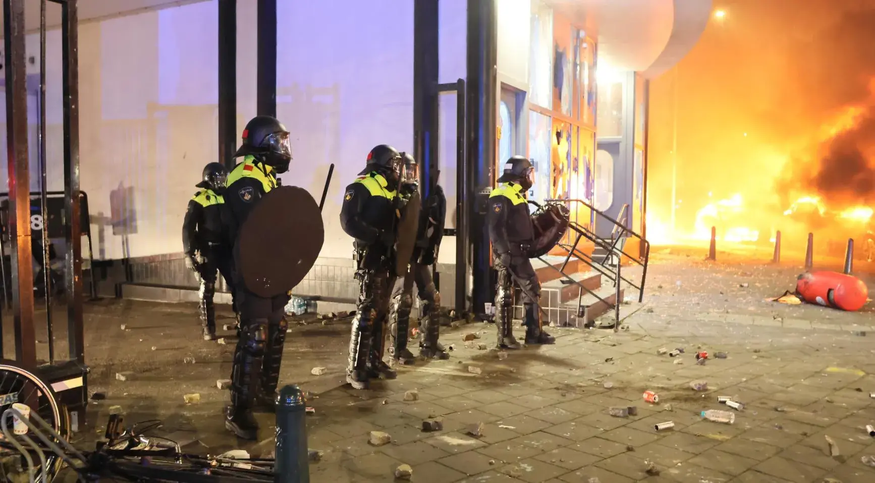 Police officers during the riots sparked by rival groups of Eritreans in the Netherlands.