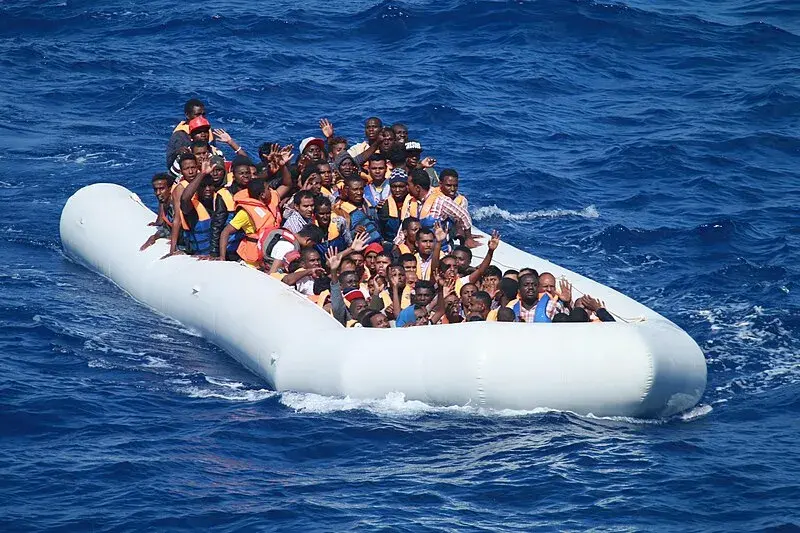 Migrants in an inflatable boat.