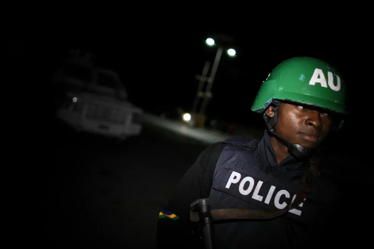 Police officer with a helmet of the African Union.