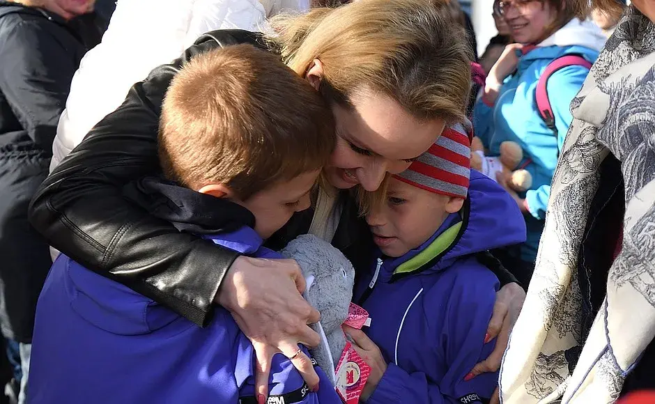 Russian Presidential Commissioner for Children’s Rights Maria Lvova-Belova, with children from Donbass area who have been moved with foster families in Russia.