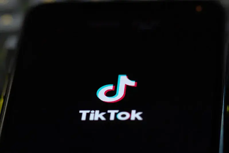 TikTok logo in a phone screen.