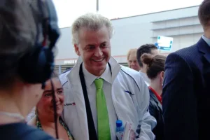 Far-right leader Geert Wilders taking a photo with a supporter.